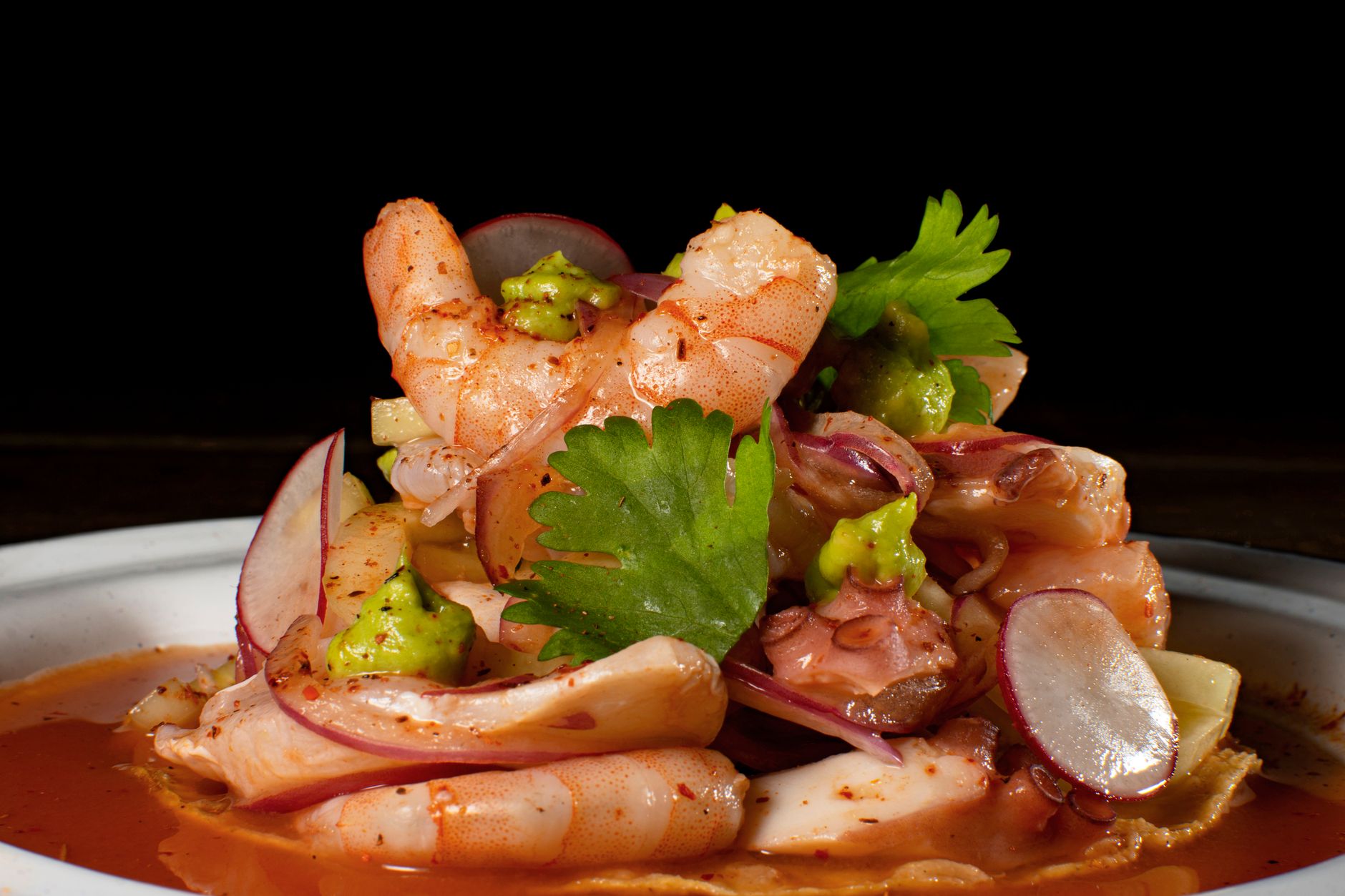 Camarones a la diabla — shrimp in a red chile sauce with avocado, radish and cilantro.